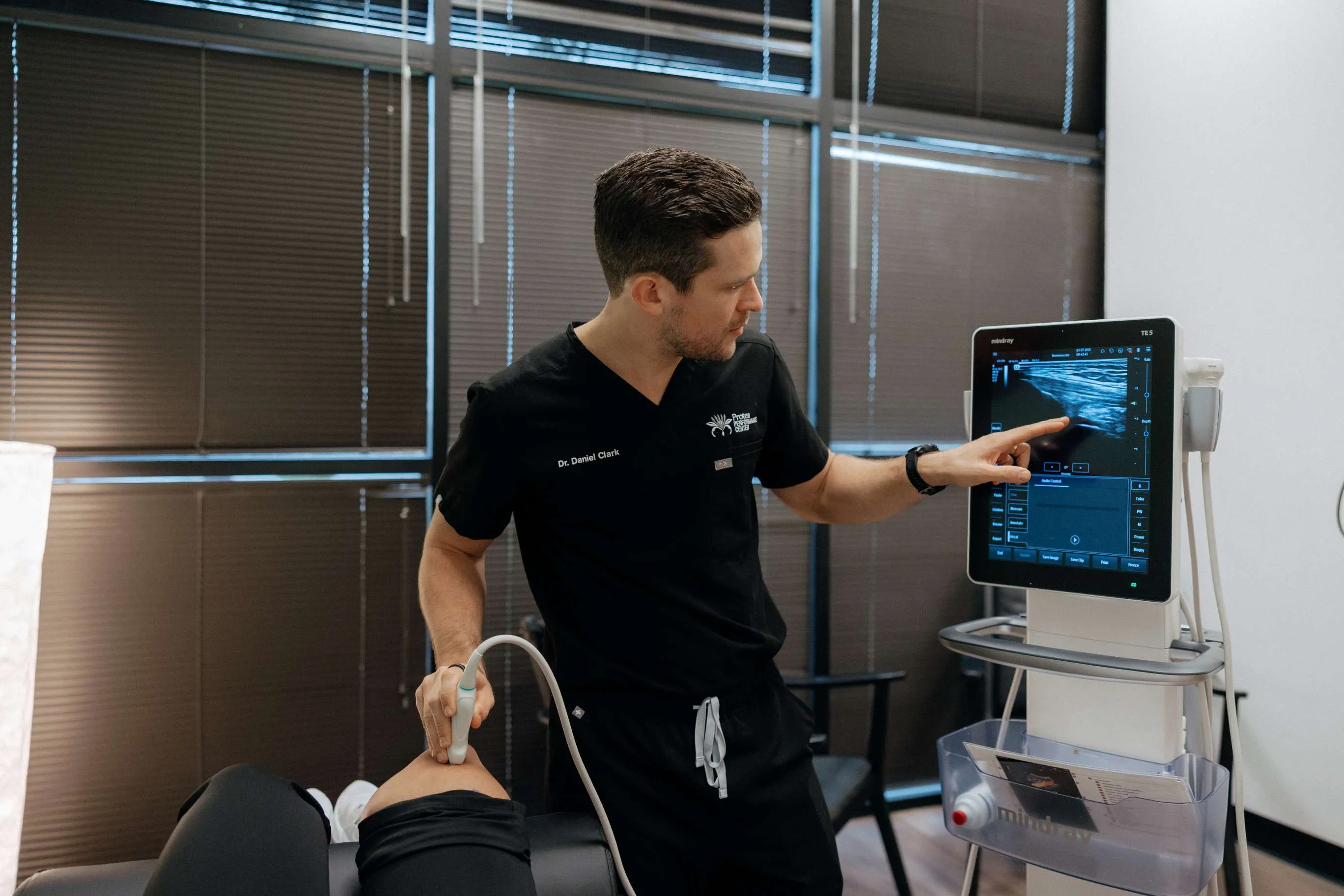 Dr. Danny Clark performing an ultrasound-guided injection in clinic